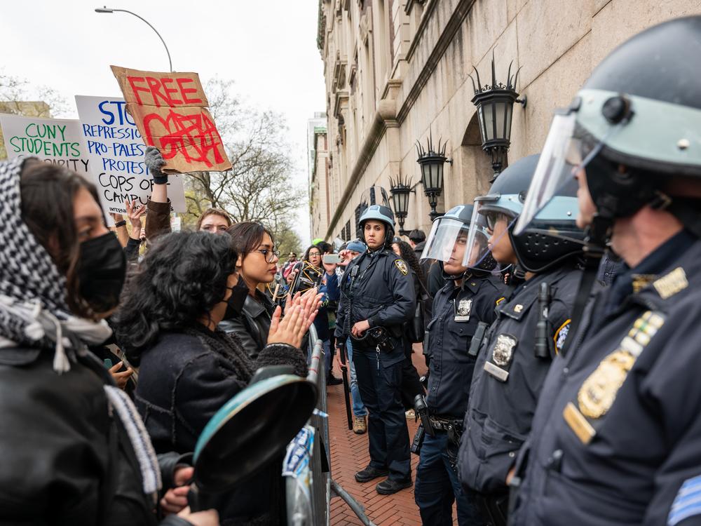 Students and pro-Palestinian activists face police outside of Columbia University to protest the university's stance on Israel on April 18, 2024, in New York City. The protests come after numerous students were arrested earlier in the day after setting up tents on the university lawn in support of Gaza.