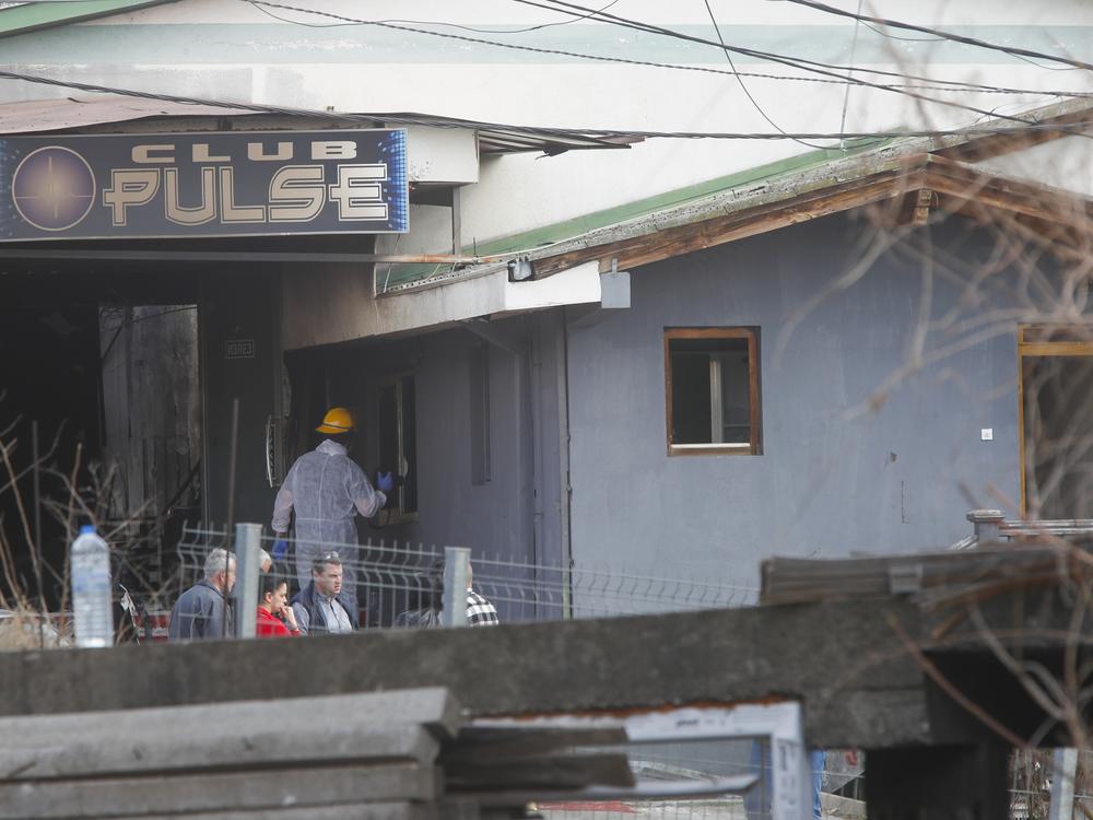 A firefighter inspects a nightclub after a massive fire in the town of Kocani, North Macedonia, on Sunday.