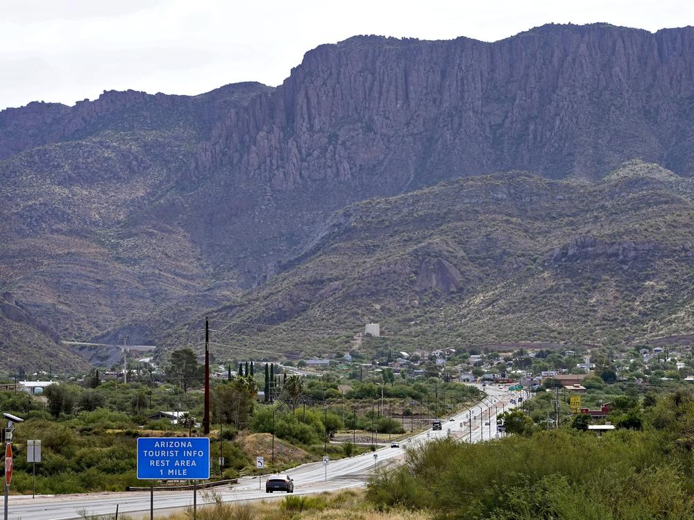 Apache Leap Mountain hovers over Superior, Ariz., on June 9, 2023. The historic mining town in central Arizona is the subject of a tug-of-war between locals who want a copper mine developed nearby for economic benefit and Native American groups who say the land needed for mining is sacred and should be protected.