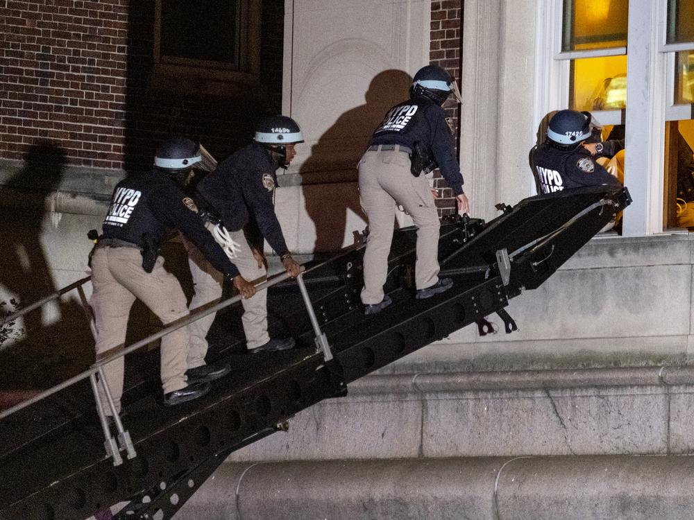 Using a tactical vehicle, New York City police enter an upper floor of Hamilton Hall on the Columbia University campus in New York, April 30, 2024, after the building was taken over by protesters earlier in the day.