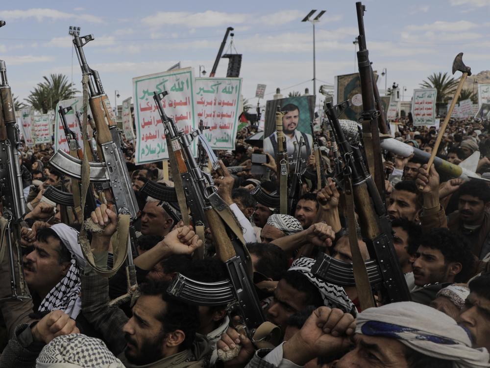 Houthi supporters chant slogans and hold pictures of Abdul Malik al-Houthi, the leader of the Houthi movement, during an anti-U.S. and anti-Israel rally in Sanaa, Yemen, Monday, March 17, 2025.