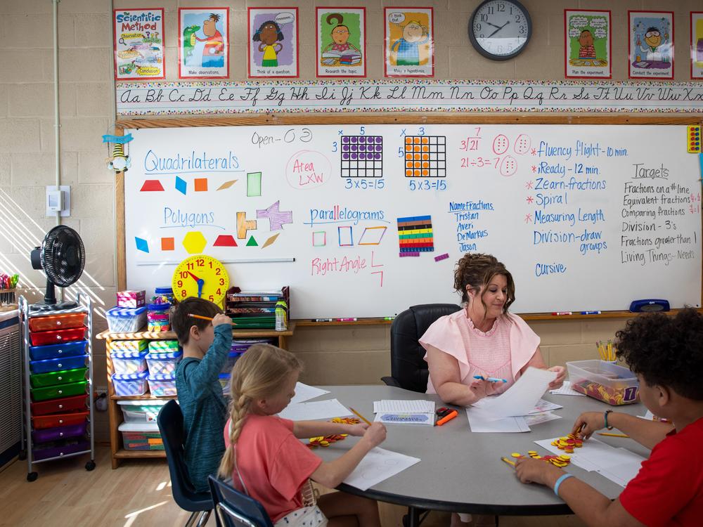 Math teacher Diane Laney hard at work in her third-grade classroom at Ider High school, which serves grades K-12. Students use counters to help model multiplication.