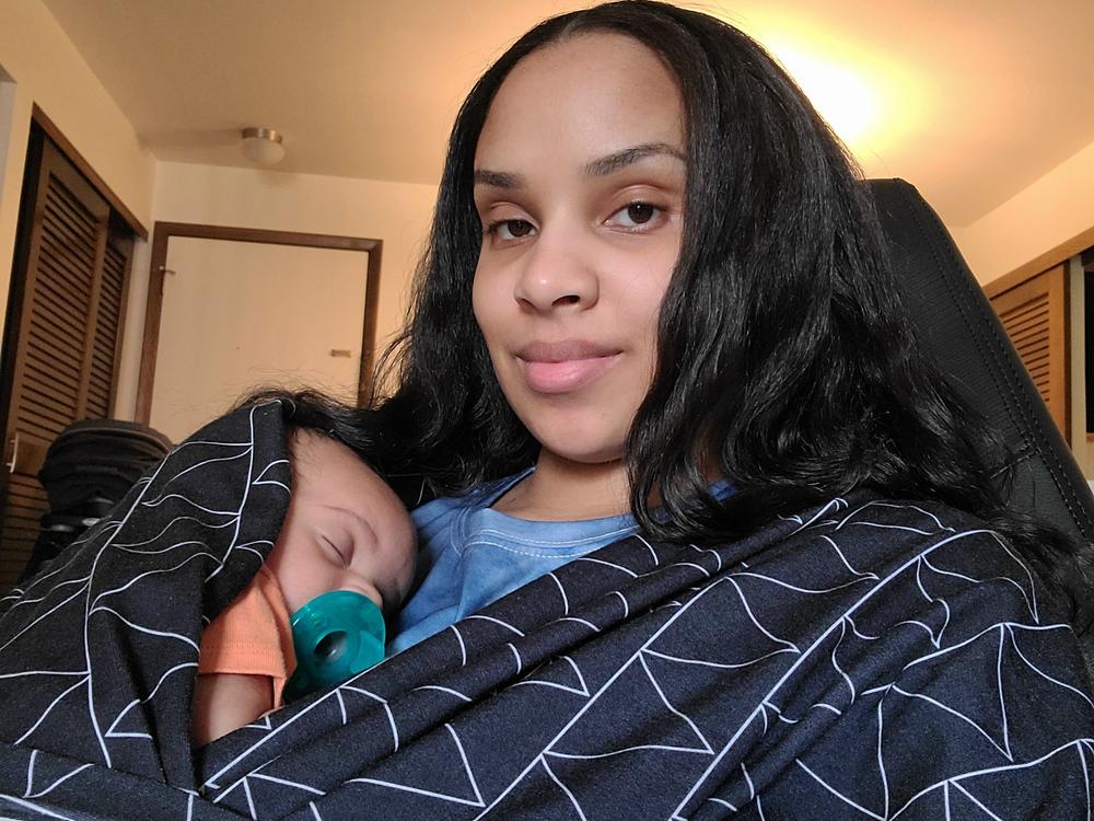 Morris held her son shortly after he was born in 2021. 