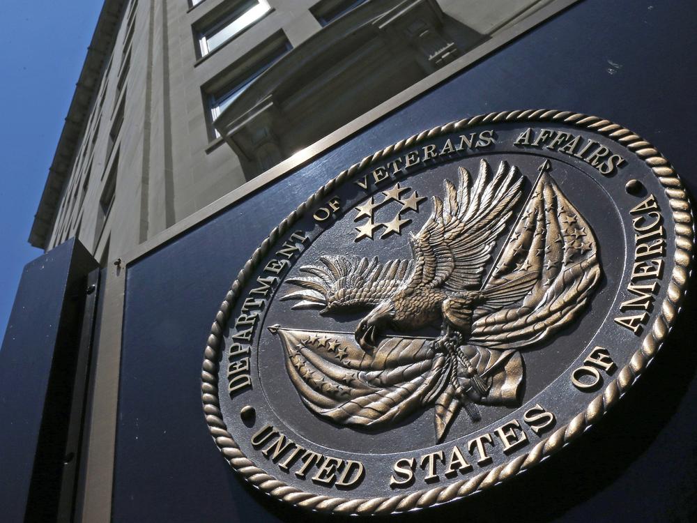 The seal of the Department of Veterans Affairs is seen outside the agency's building in Washington, D.C. The VA says it will no longer offer medical treatment for gender dysphoria to veterans.