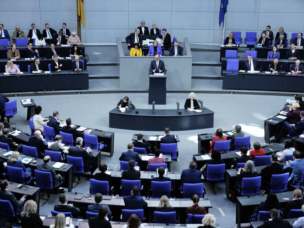 German opposition leader and Christian Democratic Union party chairman Friedrich Merz, right, speaks during a debate about loosening the country's debt rules in the Bundestag in Berlin, Germany, Tuesday.