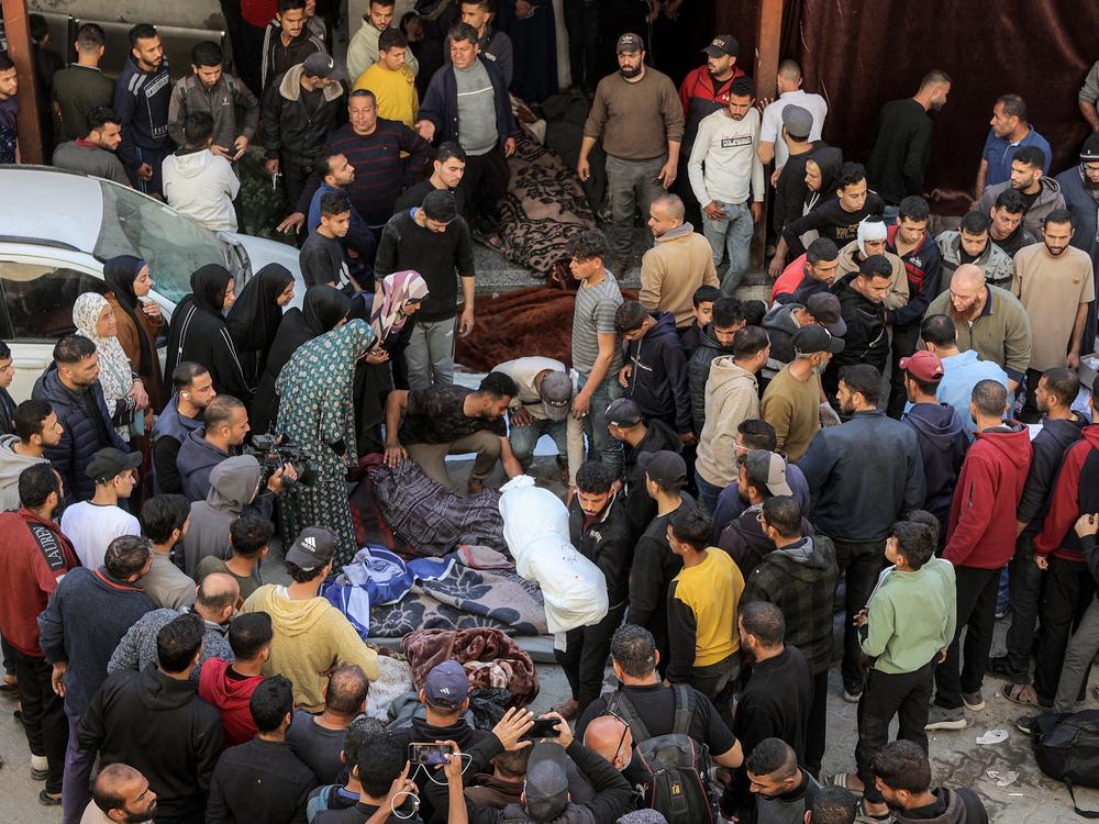People gather at Ahli Arab hospital, also known as the Baptist hospital, to mourn and bid farewell to the bodies of victims killed in Israeli bombardment, in Gaza City on Tuesday. Israel unleashed its most intense strikes on the Gaza Strip since a January ceasefire with Israel saying it was targeting Hamas fighters.