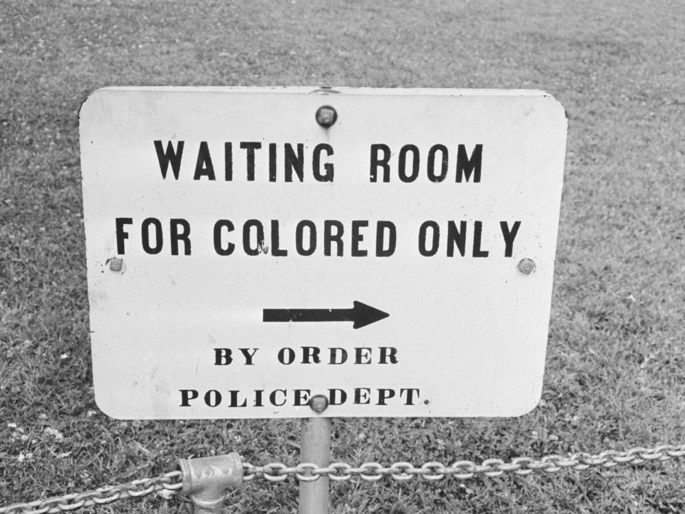 A sign in Jackson, Miss., in May 1961. The contract clause deleted from federal regulations last month dated back to the mid-1960s and specifically said entities doing business with the government should not have segregated waiting rooms, drinking fountains or transportation.
