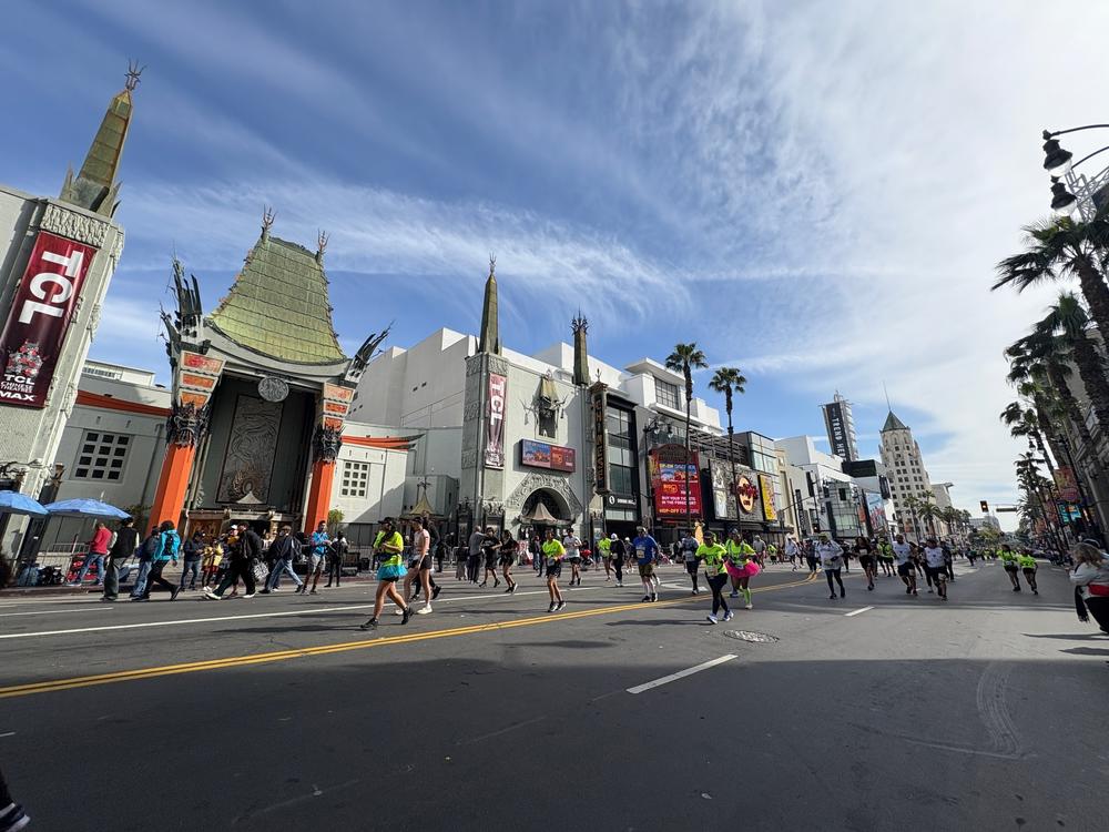 Marathon runners wind down Hollywood Boulevard on Sunday, in front of Grauman's Chinese Theater, a popular tourist landmark and the site of many film premieres.<br>
