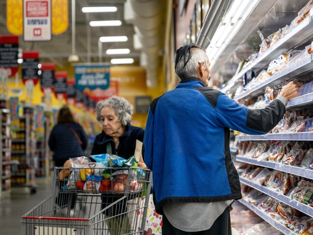 Customers shop for produce at a grocery store in Austin, Texas, on Feb. 12, 2025.