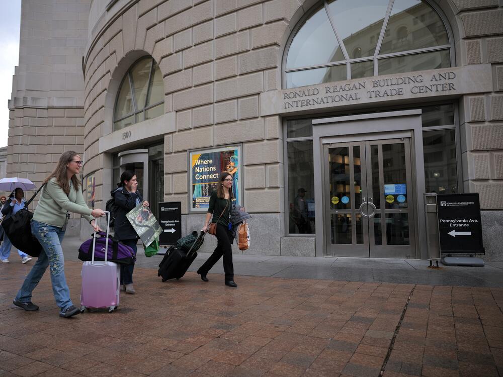 Former U.S. Agency for International Development employees terminated after the Trump administration effectively dismantled the agency collect their personal belongings at USAID headquarters on Feb. 27 in Washington, D.C.