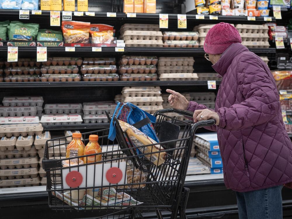 A customer shops for eggs at a  grocery store on March 12 in Chicago. Wholesale egg prices are going down, but it could take several days before grocery prices follow suit.