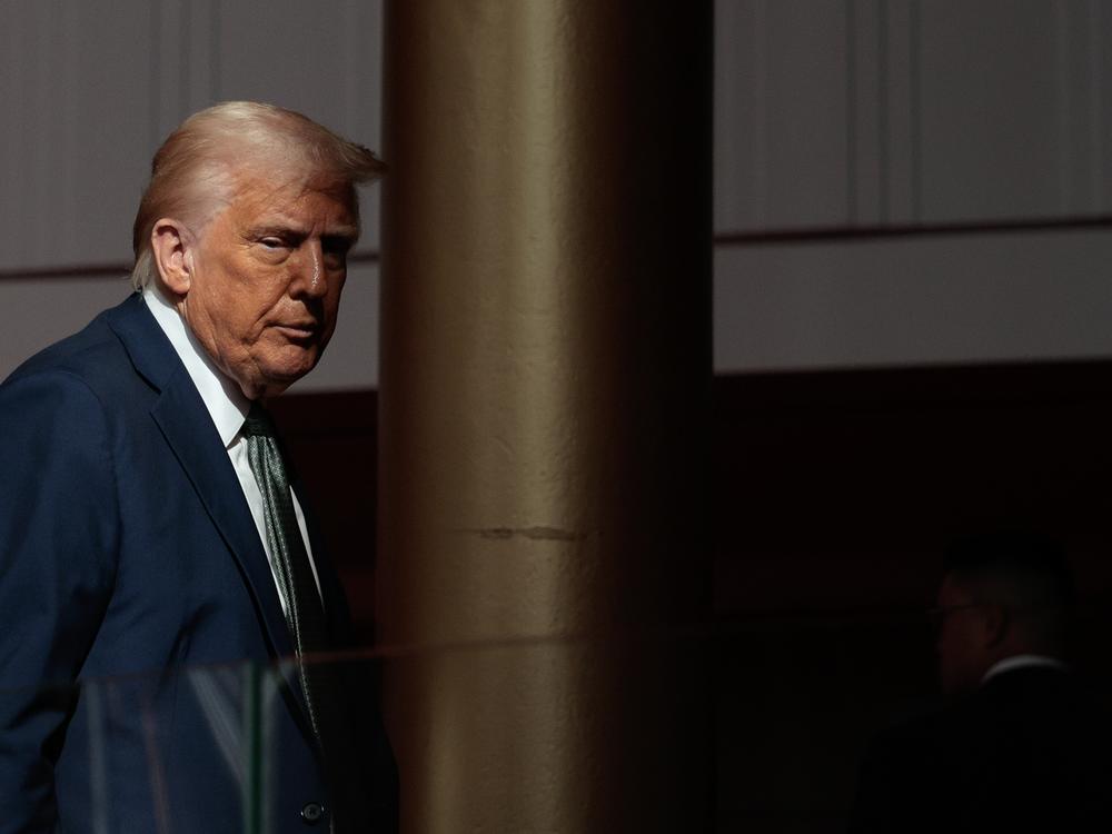 President Trump departs after speaking with reporters in the Grand Foyer during a tour at the John F. Kennedy Center for the Performing Arts on Monday.
