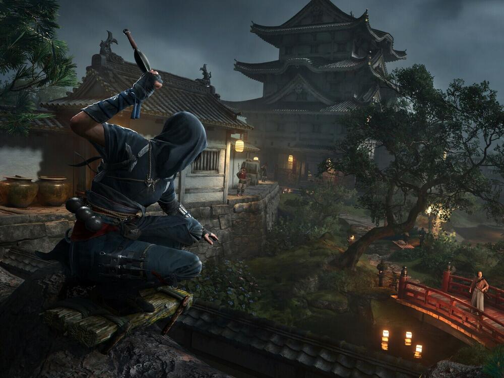 Naoe overlooks a compound in Assassin's Creed Shadows.
