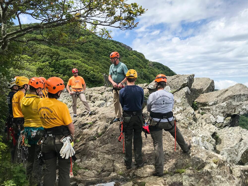 Members of the Shenandoah National Park Search and Rescue go over rope techniques as they train on a mountain cliff in Shenandoah National park, Va., on June 13, 2019.