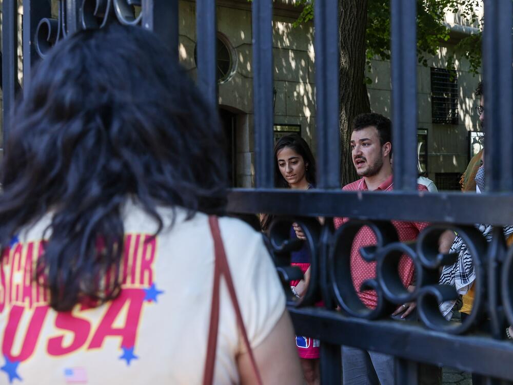 Columbia University student Mahmoud Khalil (R) talks to the press during a press briefing organized by Pro-Palestinian protesters in June 2024.