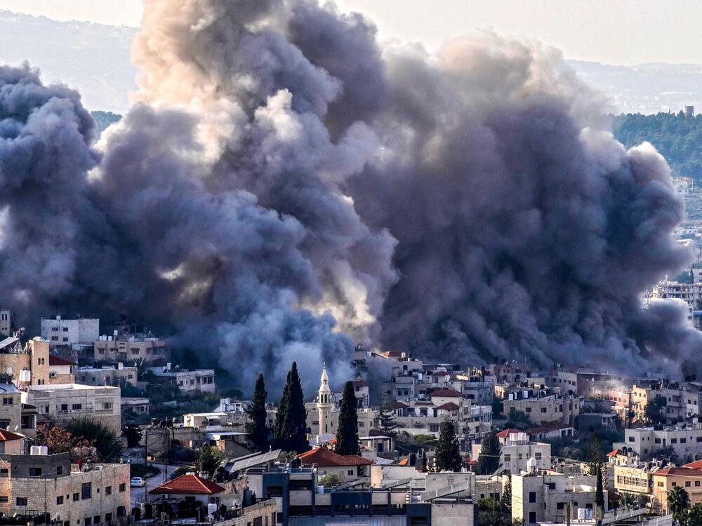 Smoke billows from the site of several explosions during an Israeli raid on the Jenin camp for Palestinian refugees on Feb. 2. The Israeli military launched a major offensive in the West Bank last month dubbed 