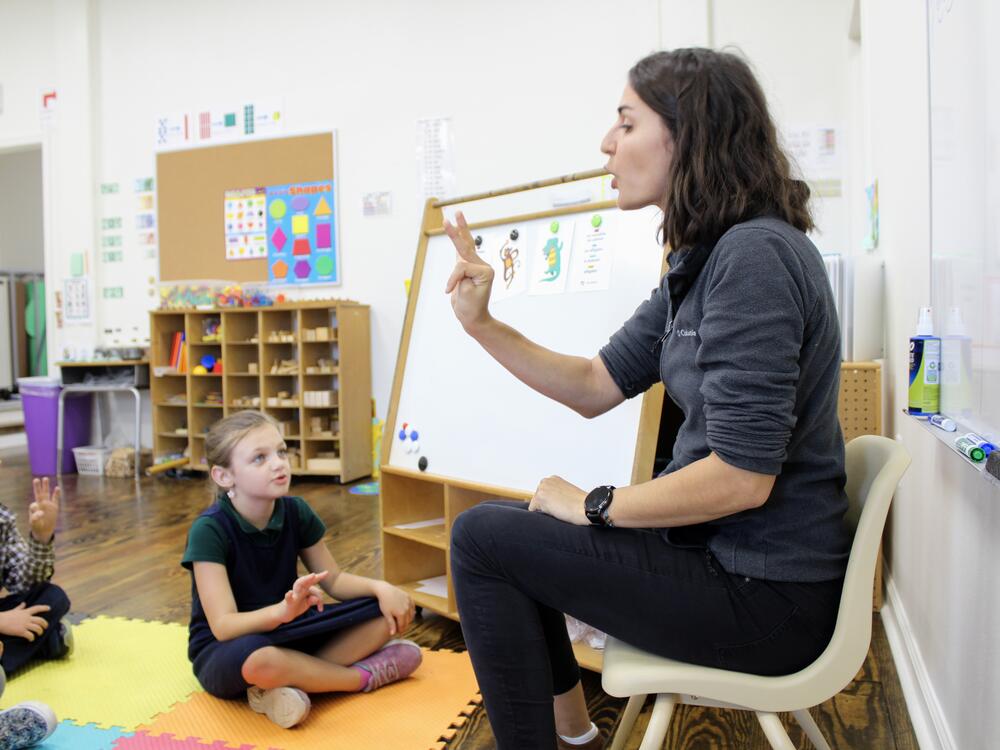 Clotilde Poujade practices French pronunciations with students at École Pointe-au-Chien, a new public French immersion school in Terrebonne Parish, La.