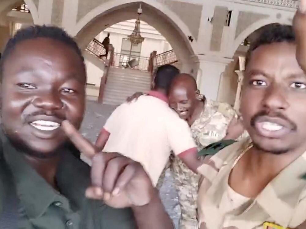 Sudanese army members film themselves inside the presidential palace, as the Sudanese army says they have taken control of the building, in Khartoum, Sudan, March 21, 2025, in this screengrab obtained from a social media video.
