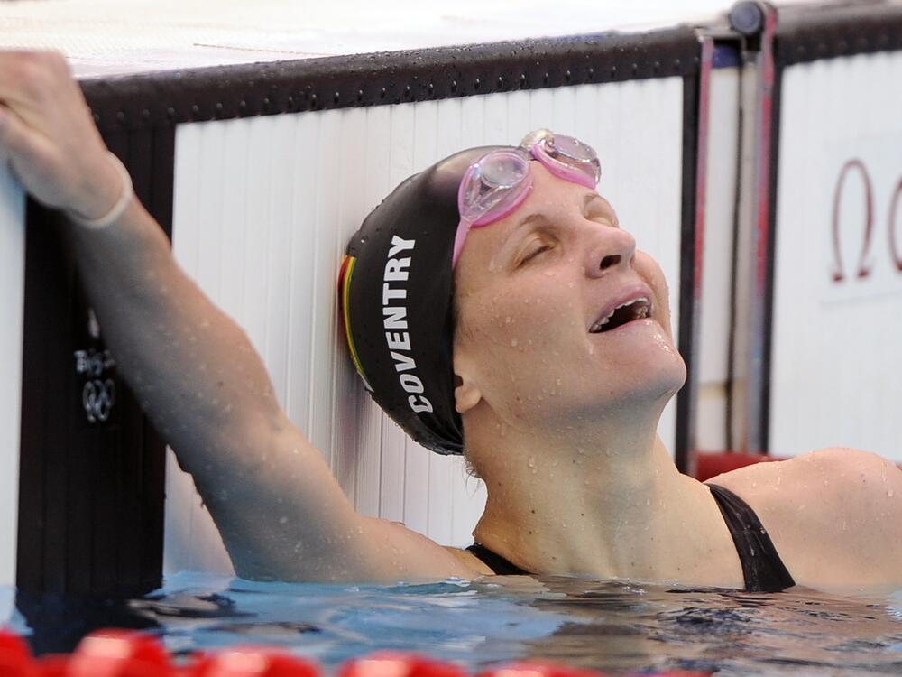 Zimbabwe's Kirsty Coventry celebrates winning the gold in the women's 200-meter backstroke final during the swimming competitions in the National Aquatics Center at the Beijing 2008 Olympics in Beijing, Saturday, Aug. 16, 2008.