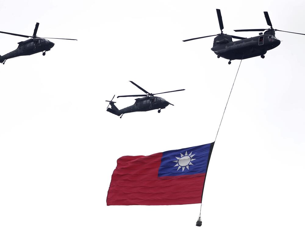Helicopters fly over with Taiwan national flag during an inauguration celebration of Taiwan's President Lai Ching-te in Taipei, Taiwan, on May 20, 2024.