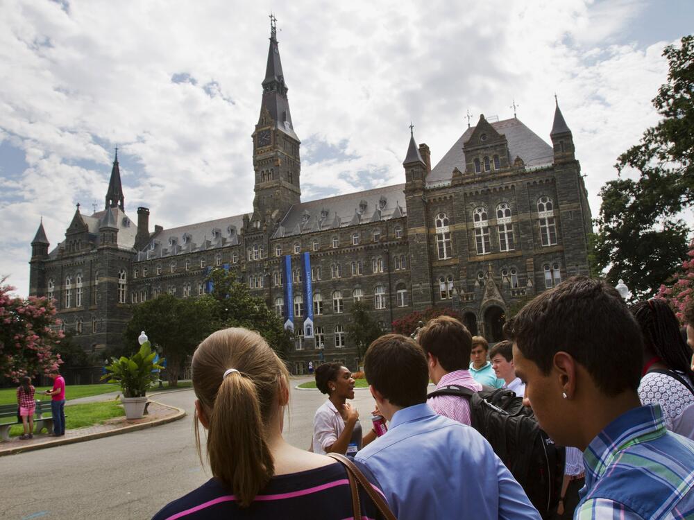 In this July 10, 2013, file photo, prospective students tour Georgetown University's campus in Washington.