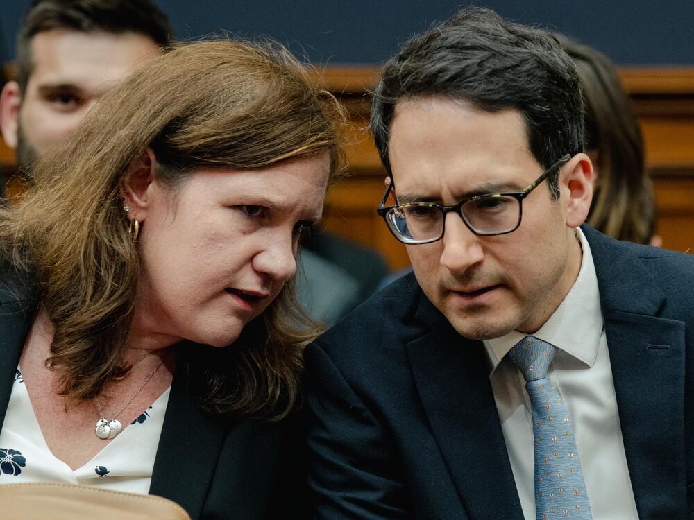 Democratic members of the Federal Trade Commission Rebecca Kelly Slaughter and Alvaro Bedoya chat during a House Judiciary Committee hearing on July 13, 2023. President Trump fired both on March 18.