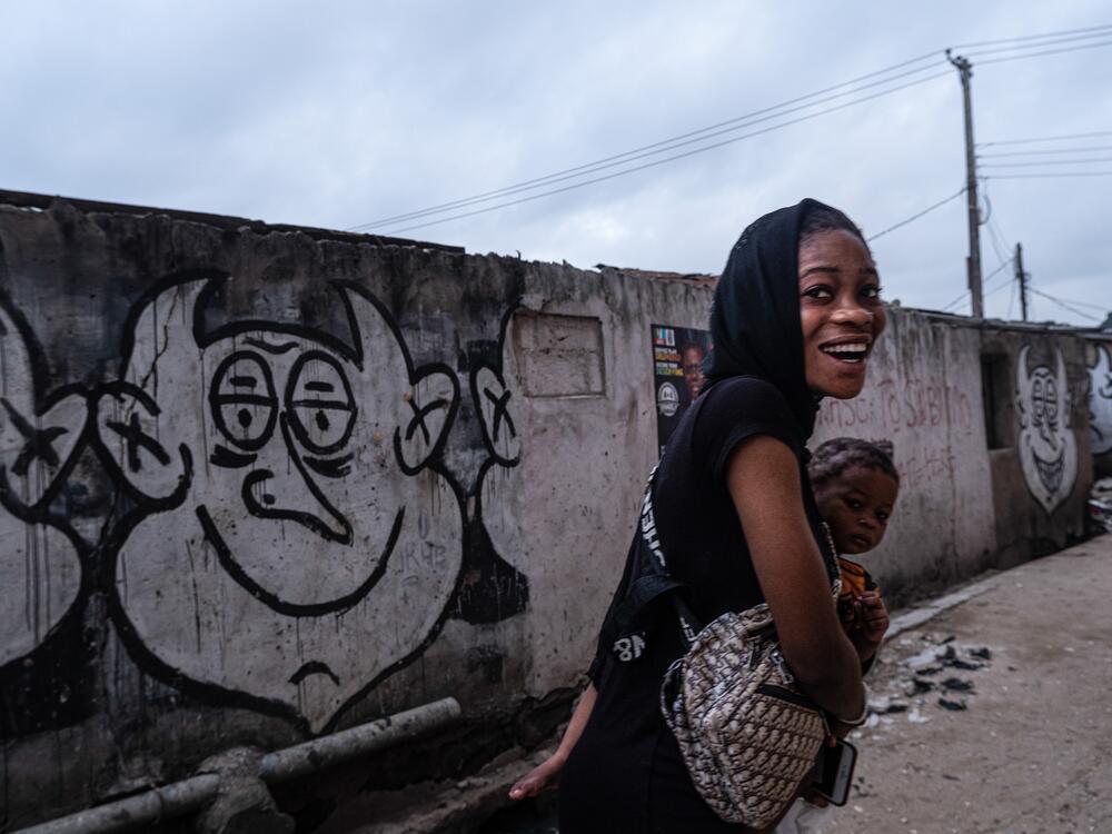 A woman takes a young girl to school in Bariga, Lagos. Photographer Fawaz Oyedeji says: 