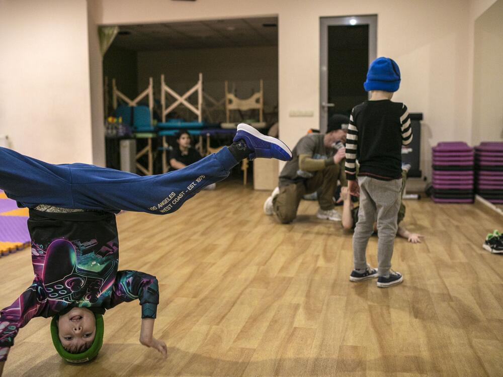Children from the eastern city of Kharkiv in Ukraine learn how to breakdance to relieve tension and stress from the ongoing war in their city and country — a moment of joy amid the sorrows of conflict.<br>