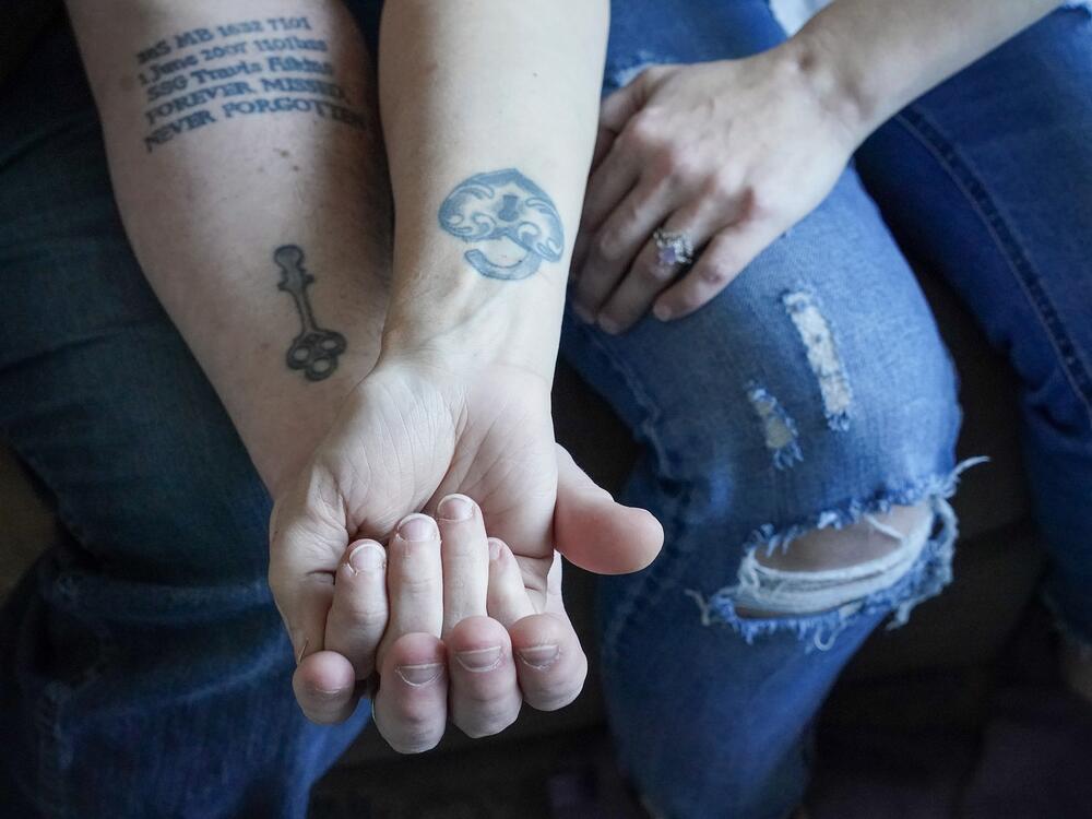 Kevin and Jenny Conlon show their lock and key tattoos, as well as Kevin's tribute to a fallen comrade.
