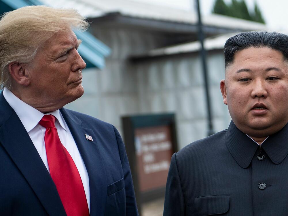 President Donald Trump and North Korea's leader Kim Jong Un talk before a meeting in the Demilitarized Zone (DMZ) on June 30, 2019, in Panmunjom, Korea.