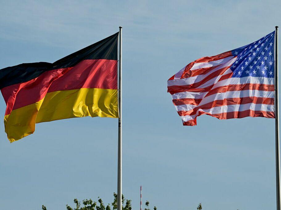 The German and the U.S. flags fly in front of the Chancellery in Berlin, on Oct. 18, 2024.