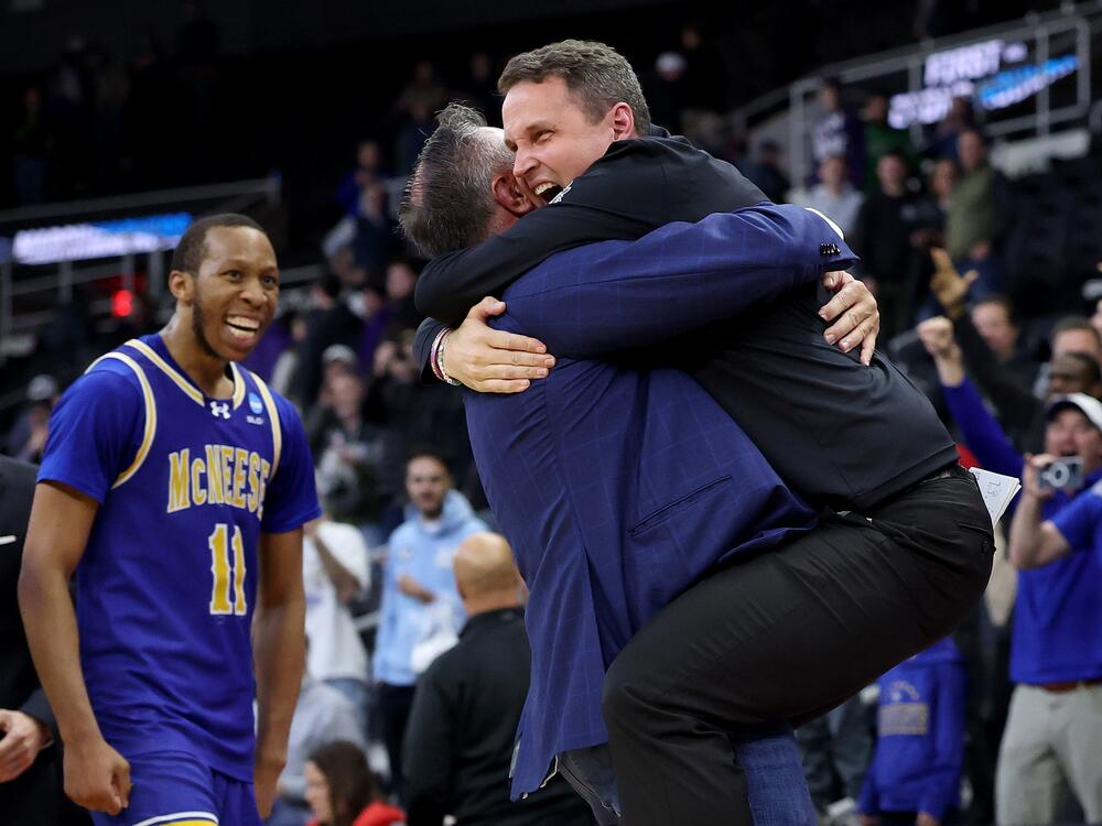 Head coach Will Wade of the McNeese State Cowboys celebrates after defeating the Clemson Tigers 69-67 in the first round of the NCAA Men's Basketball Tournament on March 20, 2025 in Providence, Rhode Island.