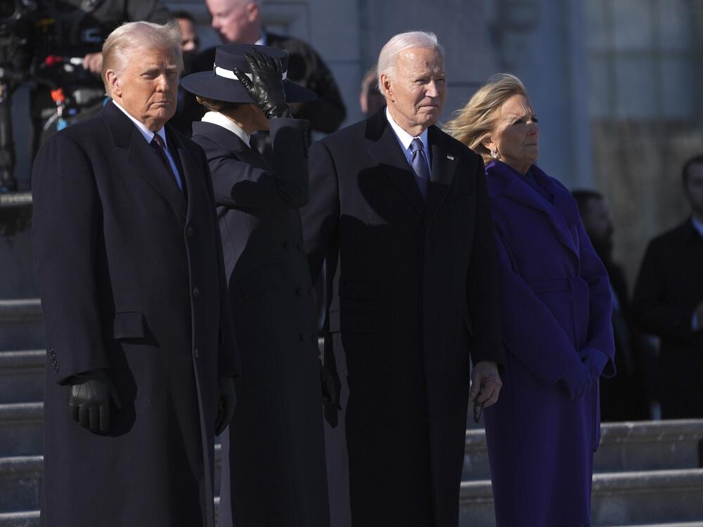 President Trump and first lady Melania Trump stand before sending off former President Joe Biden and Jill Biden to board a Marine helicopter en route to Joint Base Andrews after the inauguration on Jan. 20, at the U.S. Capitol in Washington.