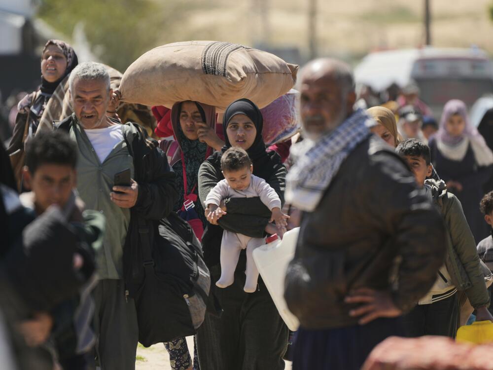 Displaced Palestinians, who flee from Rafah amid ongoing Israeli military operations following Israel's renewed offensive in the Gaza Strip, arrive in Khan Younis, Gaza, on Sunday.
