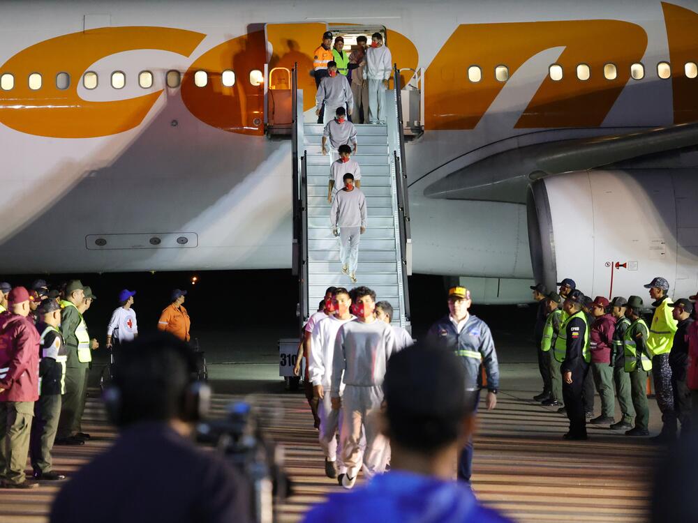 Venezuelan migrants deported by the U.S. disembark from a plane at Simon Bolivar International Airport in La Guaira, Venezuela on Feb. 20.