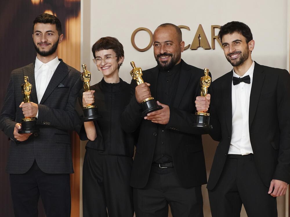Basel Adra (from left), Rachel Szor, Hamdan Ballal, and Yuval Abraham, winners of the award for best documentary feature film for <em>No Other Land</em>, pose in the press room at the Oscars on March 2 at the Dolby Theatre in Los Angeles.