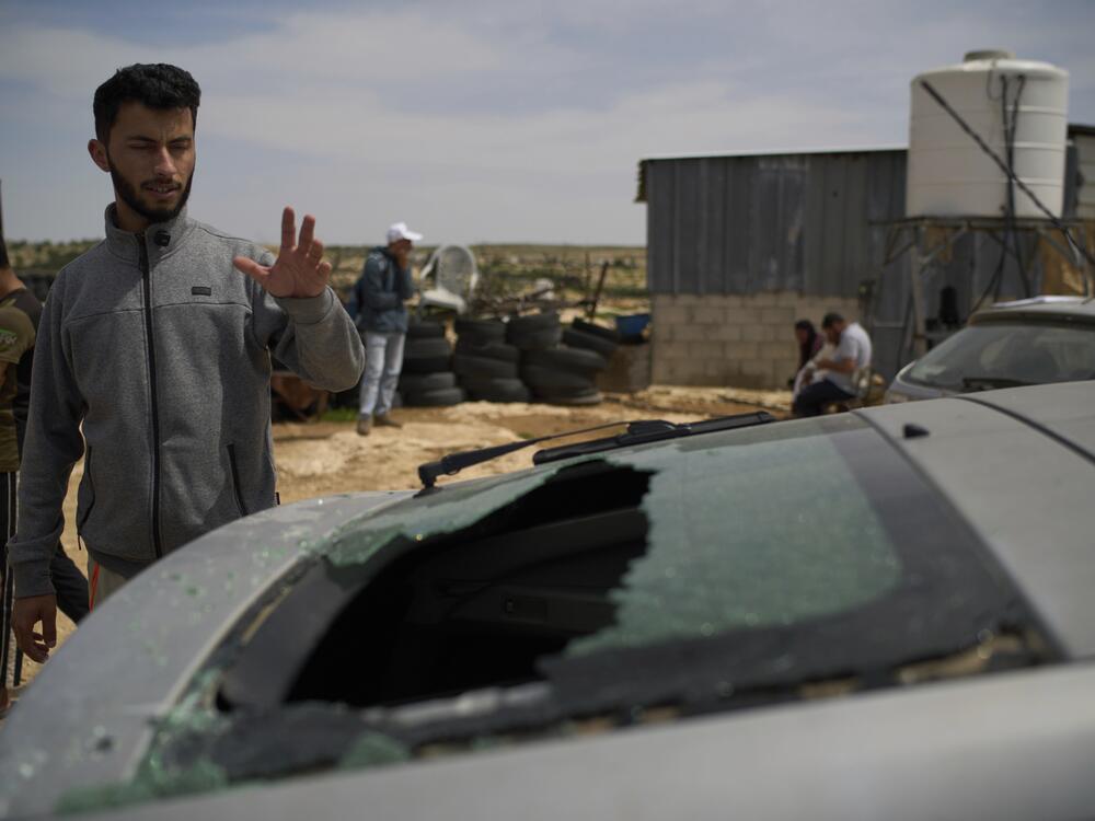 Basel Adra, another of the Palestinian co-directors of the Oscar-winner documentary <em>No Other Land</em>, on Tuesday looks at the damaged car belonging to fellow director Hamdan Ballal, who was attacked by Jewish settlers before being detained by the Israeli army, in the village of Susiya, in Masafer Yatta, south Hebron Hills.
