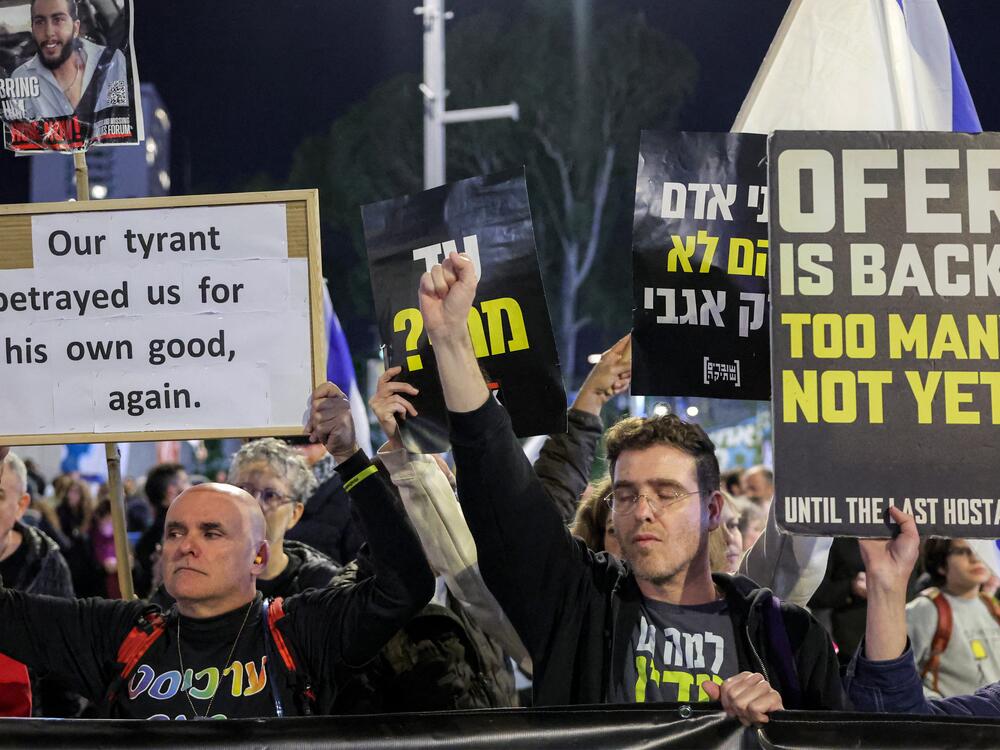 Demonstrators gather outside the Israeli Defense Ministry headquarters in Tel Aviv, Israel, on March 22, during an anti-government protest calling for action to secure the release of Israeli hostages held captive in the Gaza Strip since the Oct. 7, 2023, attacks by Palestinian militants.