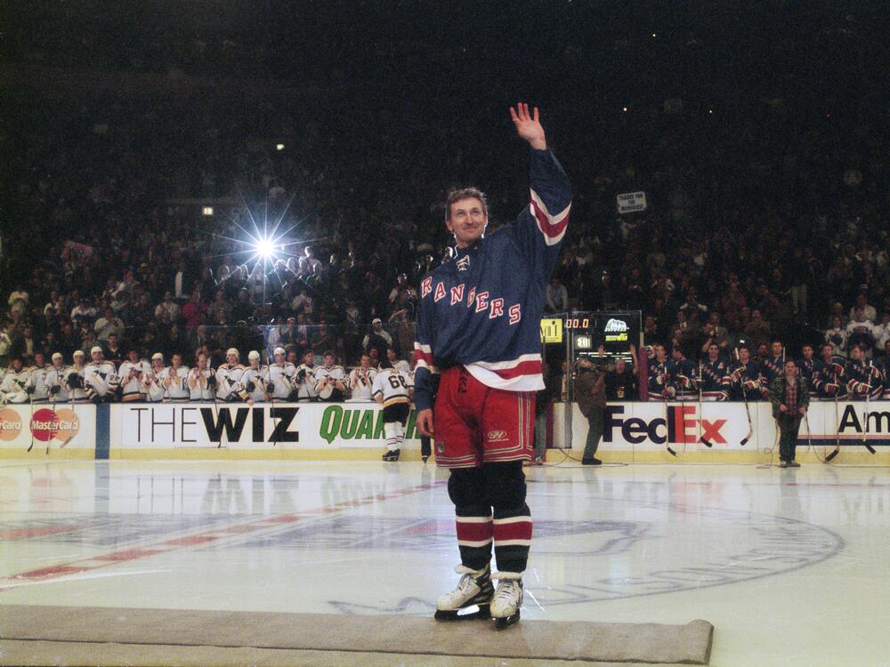 Wayne Gretzky waves to the crowd at New York City's Madison Square Garden after his last game in the National Hockey League, against the Pittsburgh Penguins on April 18, 1999.