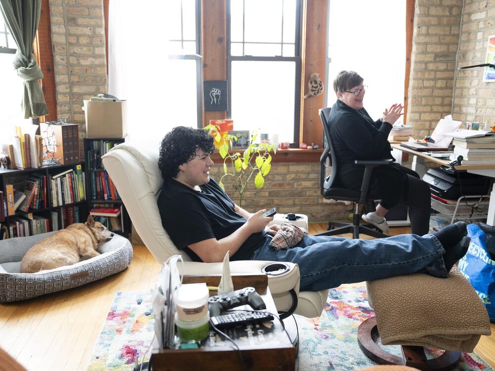 Michelle Vallet watches a show with her son Ben Garcia at their home in Rogers Park on Feb. 14. |