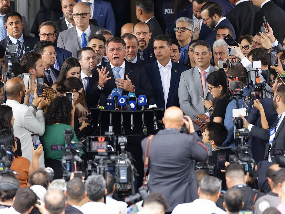 Former Brazilian President Jair Bolsonaro speaks to reporters after the Supreme Court voted that he should stand trial for allegedly attempting a coup after his 2022 electoral defeat, in Brasilia, Brazil, Wednesday.
