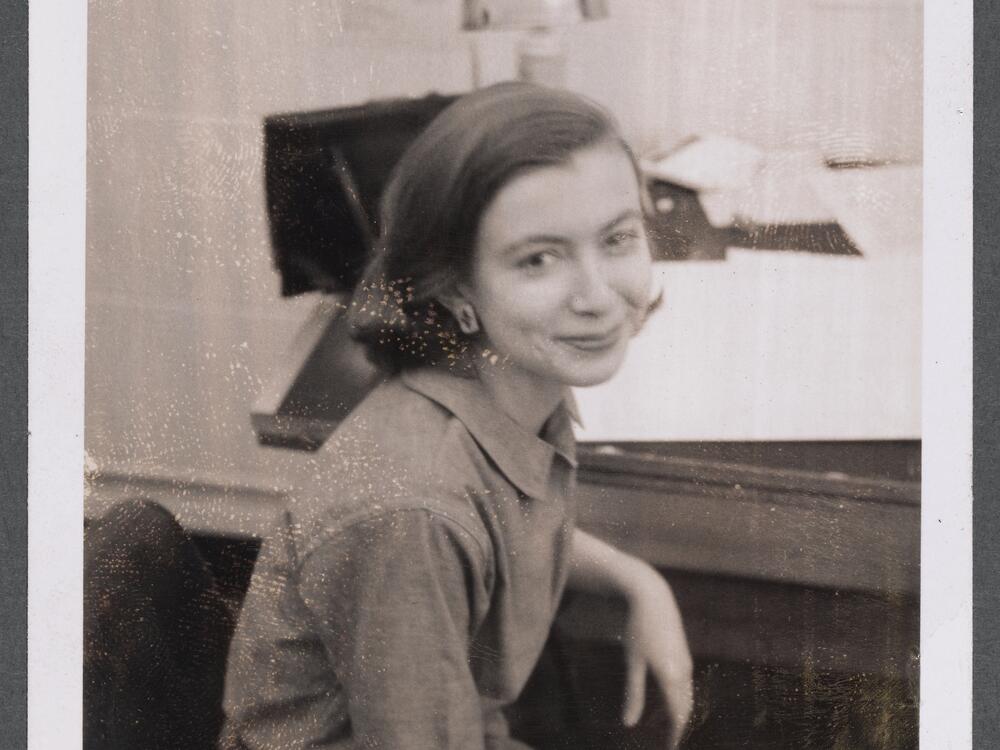 Photograph of Joan Didion in the Vogue Art Department, c. 1958