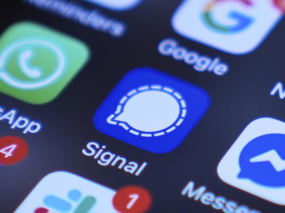 Signal app on a smartphone is seen on a mobile device screen.