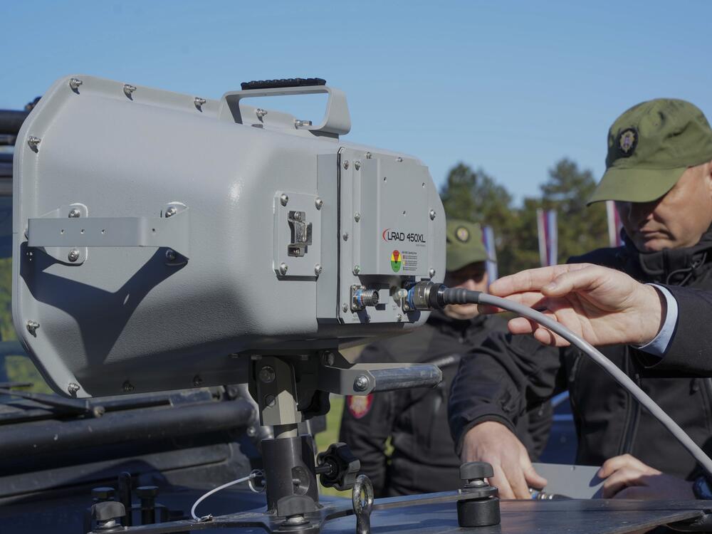 In this photo provided by the Serbian Interior Ministry, Serbian Gendarmerie officers show the U.S.-made Long Range Acoustic Device (LRAD) – which is illegal in Serbia and many other countries, in Belgrade, Serbia on March 19, 2025.
