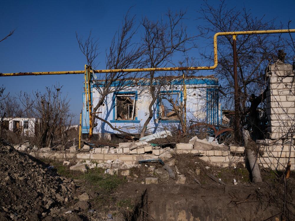 Despite repair efforts beginning, many homes in Posad-Pokrovske, like this one, remain crumbling shells.