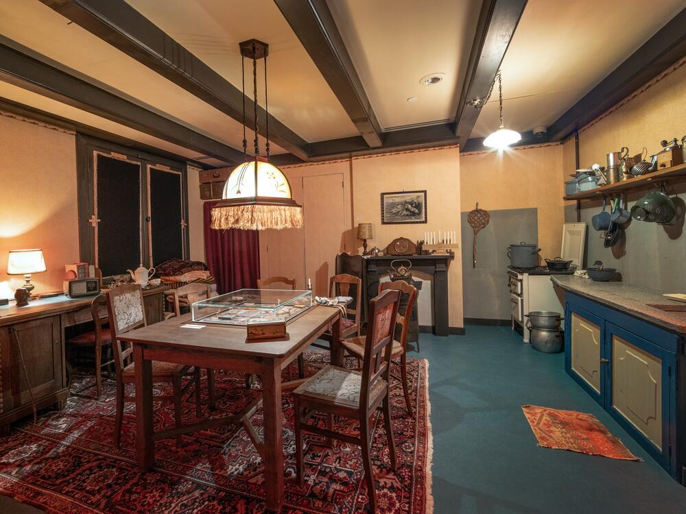 The room of Hermann and Auguste van Pels. On table is a board game similar to the one given to their son Peter on his sixteenth birthday. It was one of the only forms of entertainment or play available in hiding.