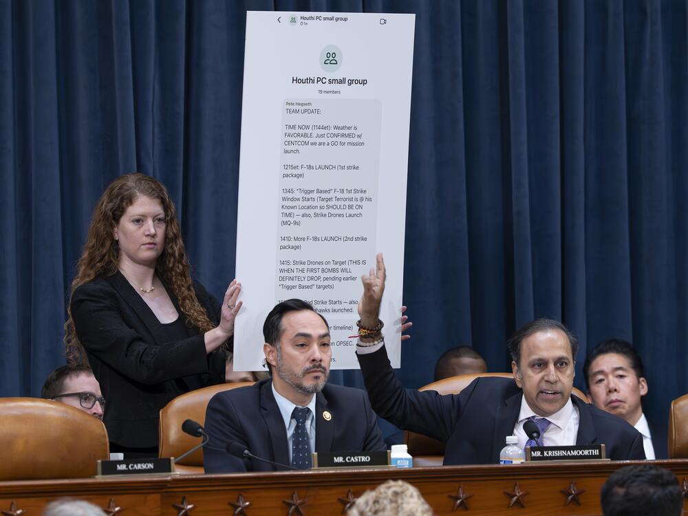 Rep. Raja Krishnamoorthi, D-Ill., (right), joined by Rep. Joaquin Castro, D-Texas, points to a chart displaying a text message by Defense Secretary Pete Hegseth in a group chat that revealed U.S. military plans in Yemen to a journalist, at a House Intelligence Committee hearing Wednesday in Washington.