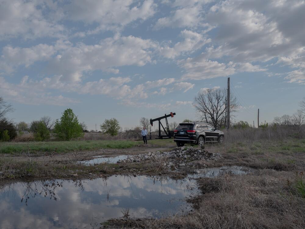 Scott Rabinowitz, president of Grand Resources, stands near a pump jack in Sperry, Okla., on March 20, 2024.