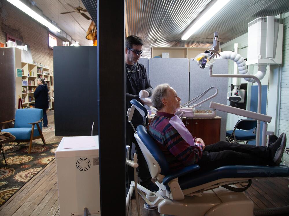 Dentist James Flanagin operates out of a small clinic in the back of an antique store in Leslie, Ark. Leslie is one of hundreds of American communities, mostly rural, that have both a shortage of dentists and unfluoridated drinking water. <br>