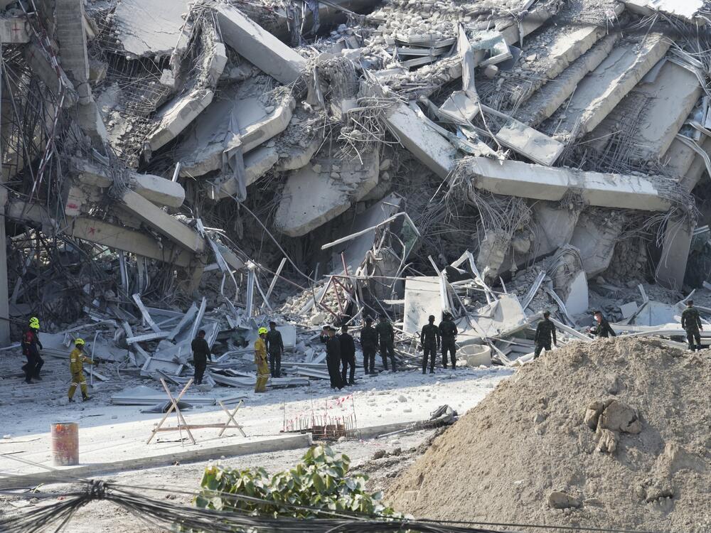 Rescuers work at the site of a high-rise building under construction that collapsed after a 7.7 magnitude earthquake in Bangkok, Thailand on Friday.